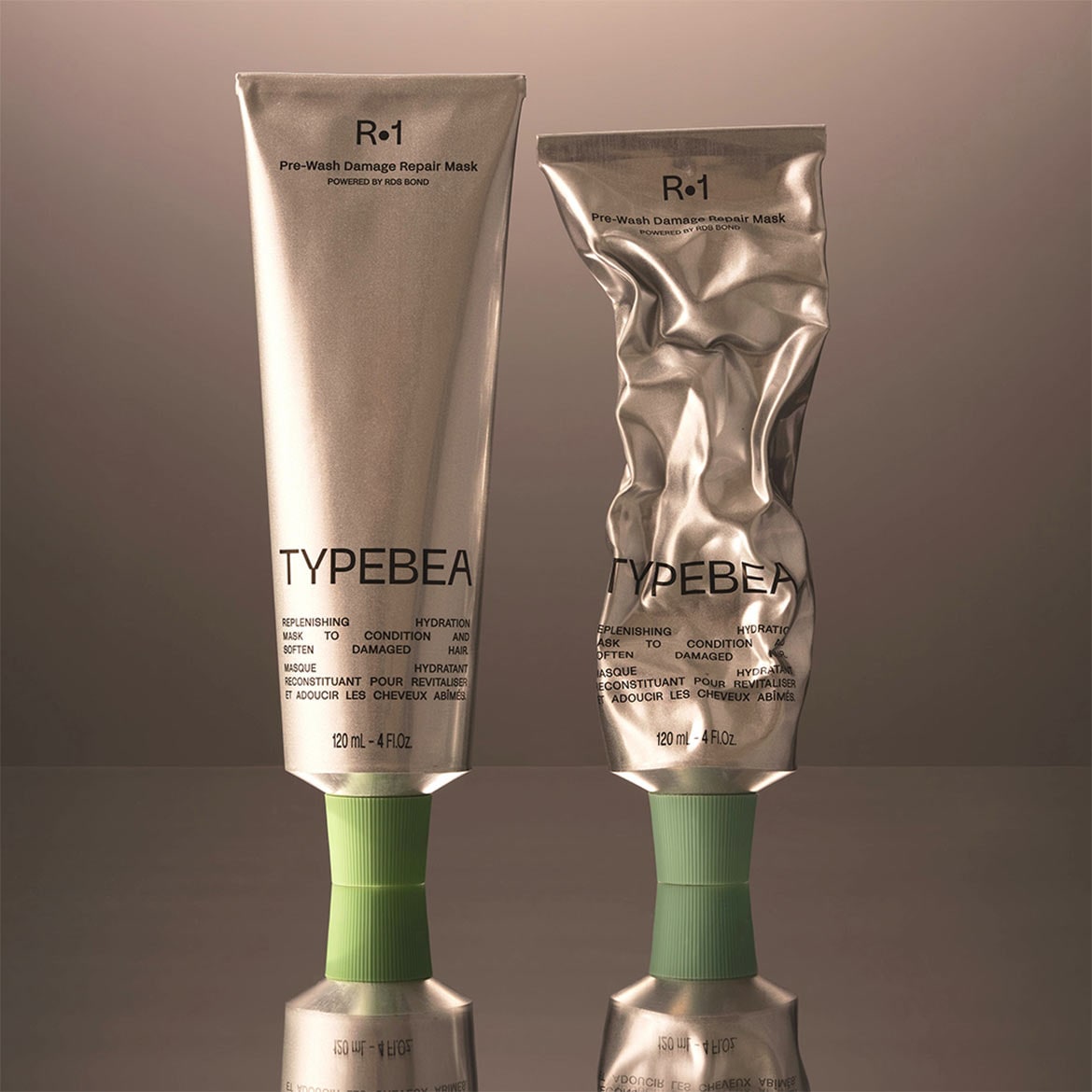 Voici le masque réparateur avant-shampooing R-1 TYPEBEA dans un tube argenté, conçu pour hydrater et revitaliser les cheveux abîmés.